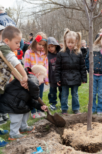 Children Help Plant Tree