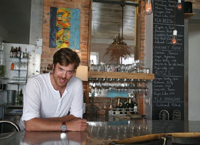 James-Emery Elkin Behind Bar at Microclimate